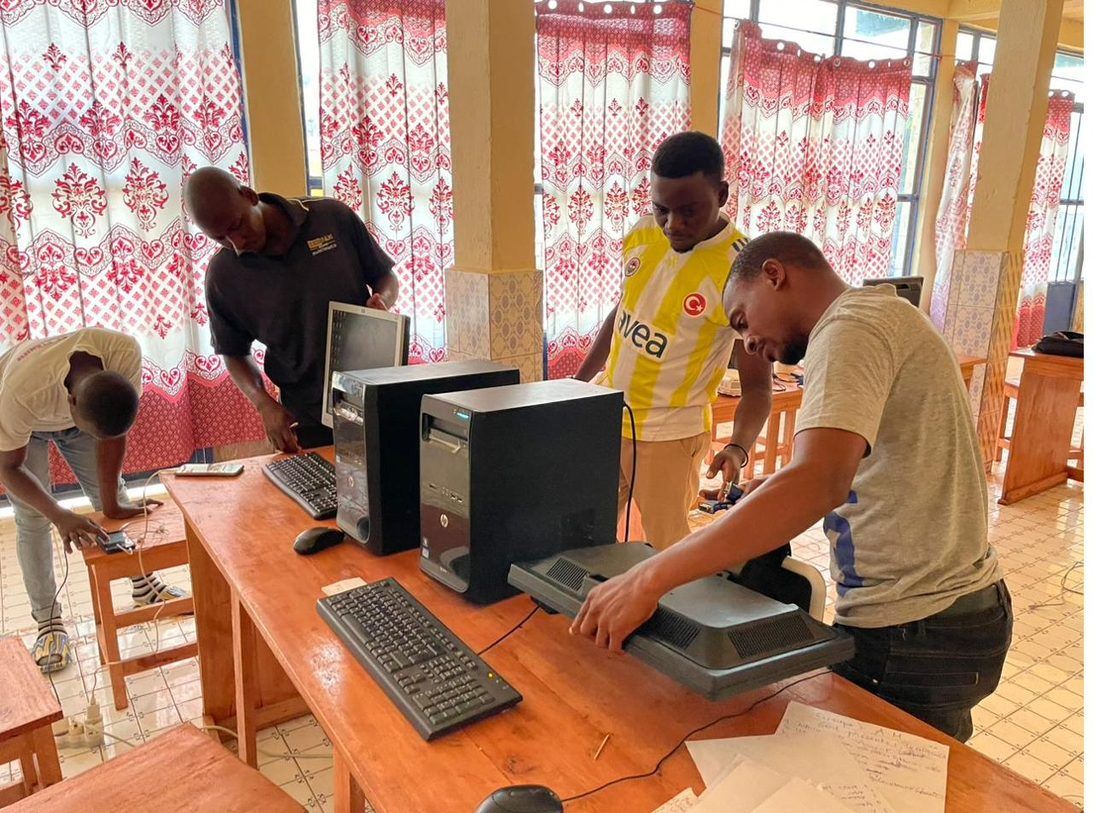 A young person practicing computer repair